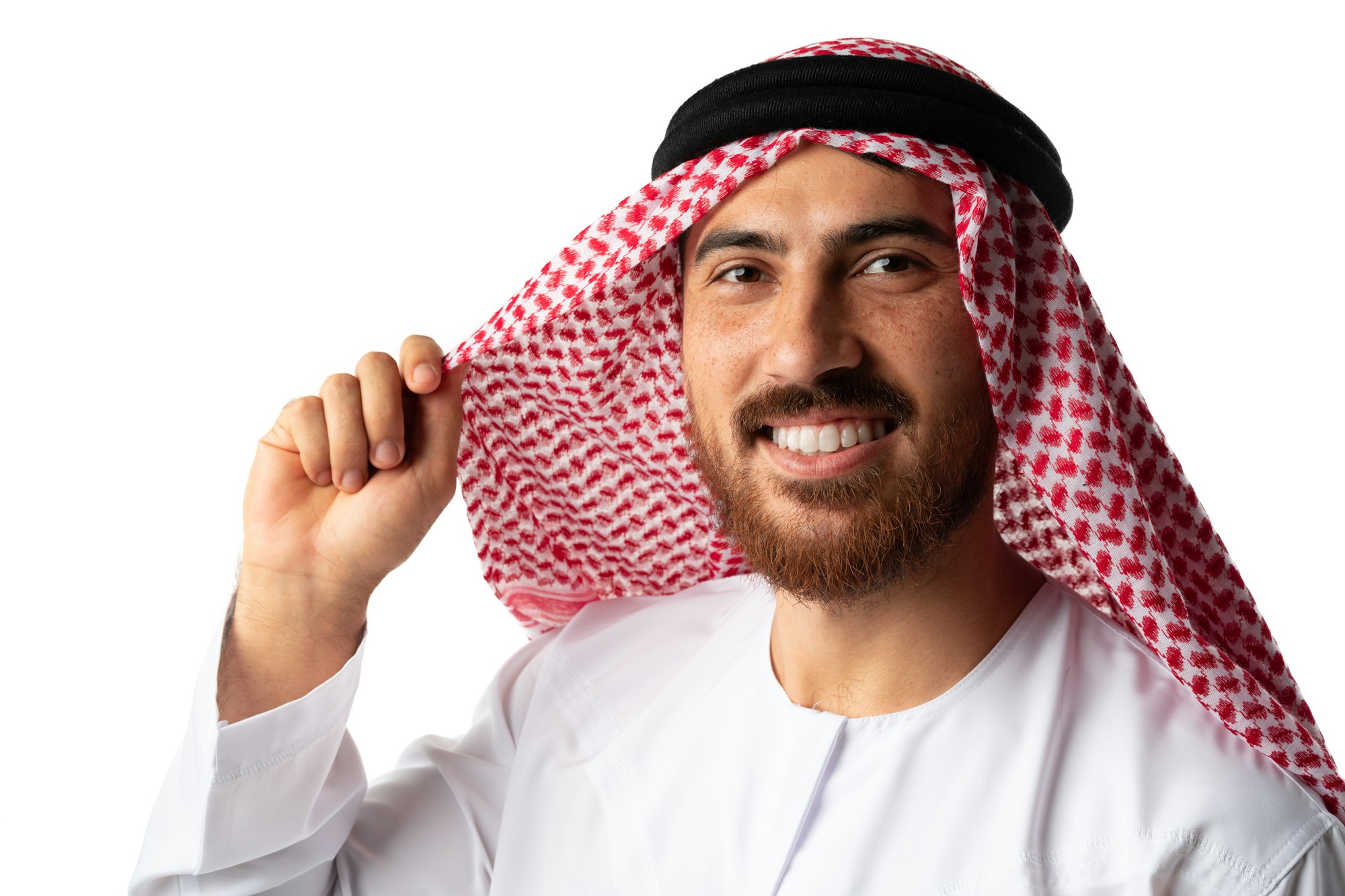 Smiling arab man while standing in a white studio